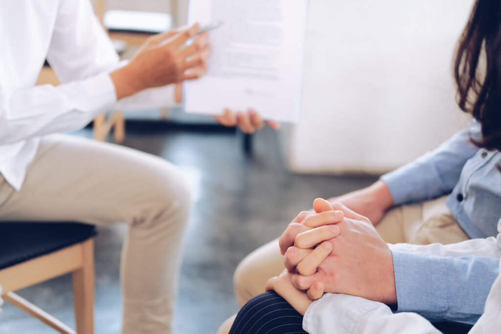 couple consulting lawyer about contract. insurance broker financ